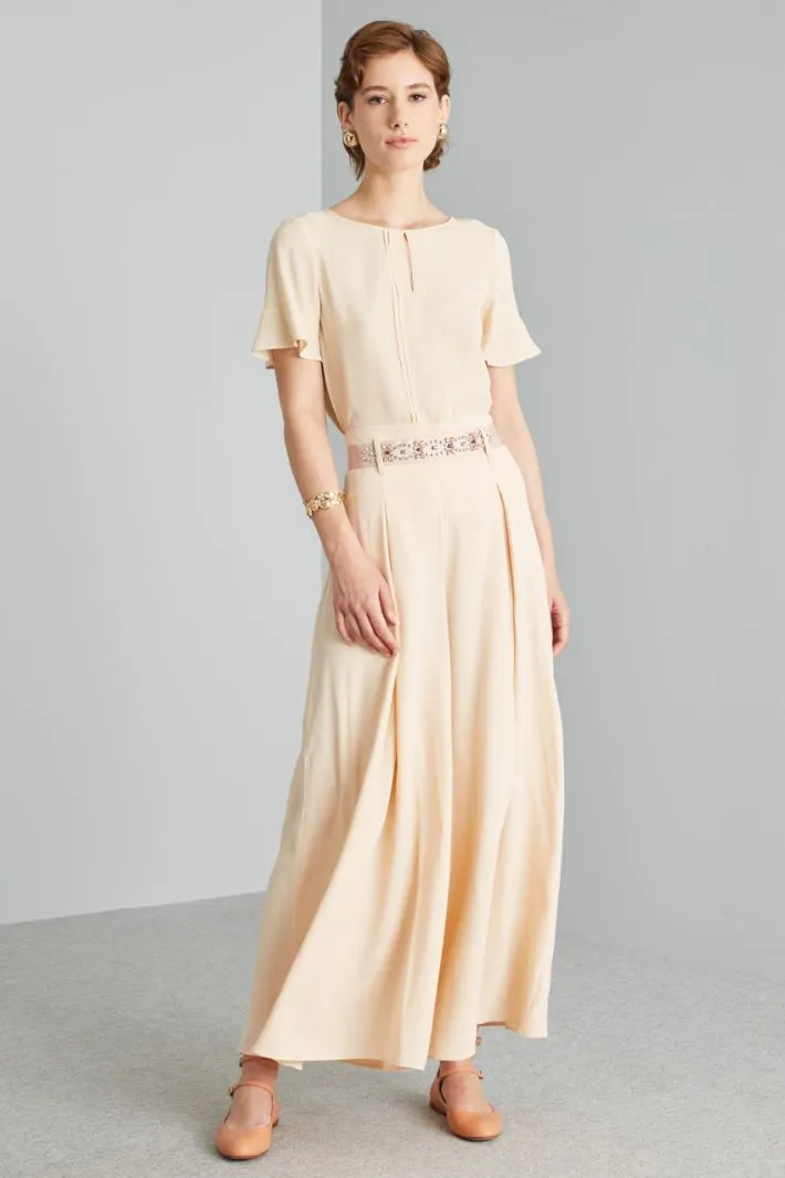 Blusa con pieghe ribattute