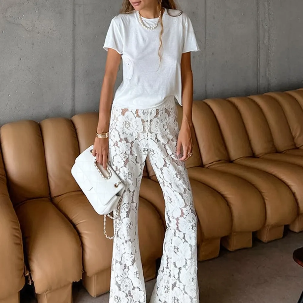 Pantaloni a zampa d'elefante jacquard e 2024 primavera ed estate nuove donne pizzo jacquard fiore cavo dimagrante micro-svasato