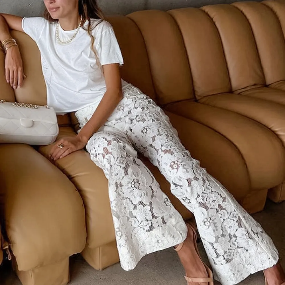 Pantaloni a zampa d'elefante jacquard e 2024 primavera ed estate nuove donne pizzo jacquard fiore cavo dimagrante micro-svasato