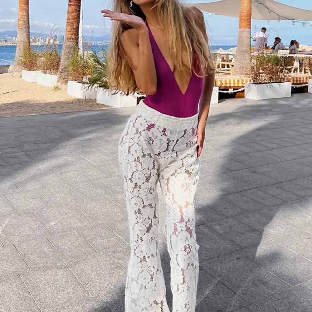 Pantaloni a zampa d'elefante jacquard e 2024 primavera ed estate nuove donne pizzo jacquard fiore cavo dimagrante micro-svasato